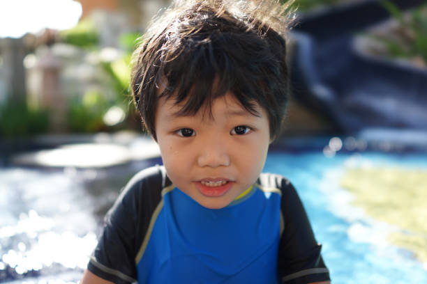istock happy little boy in a paddling pool 1227183067