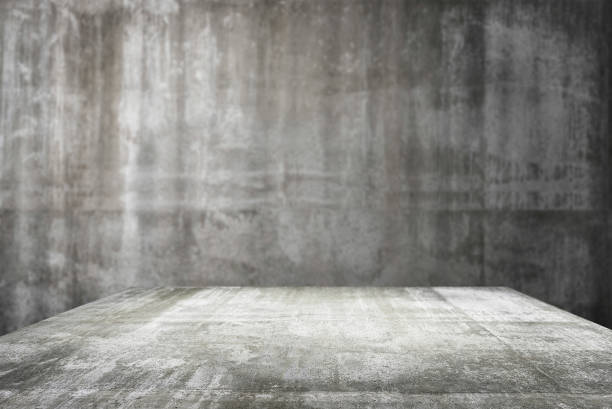 istock empty table top Ready for product display montage; cement table and gray cement background. 1227183258