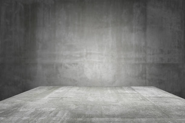 istock empty table top Ready for product display montage; cement table and gray cement background. 1227183267