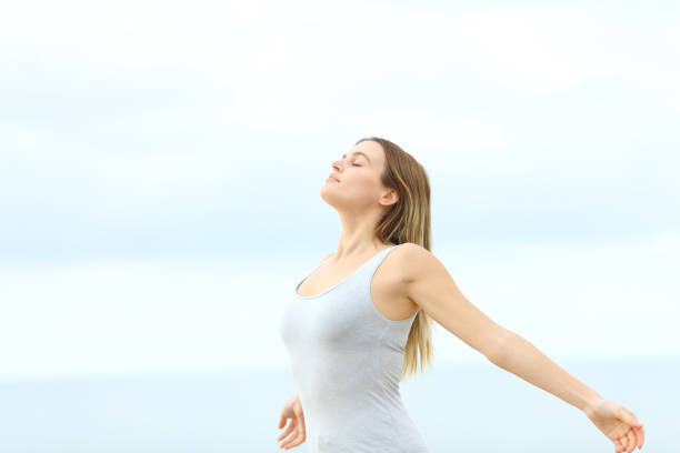 istock Woman breathing fresh air at the beach 1227183643