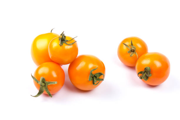istock Yellow fresh tomatoes  isolated on white background in close-up 1227184840