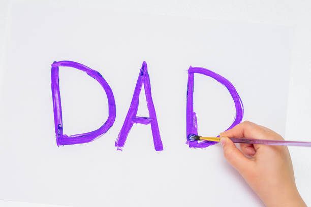 istock Child is drawing Father's day greeting card. 1227184877