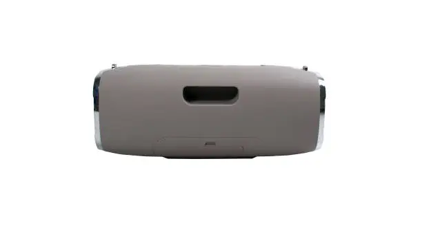 Portable grey speaker with the removable soft handle. Connect with smartphone or pc to play the music. Close up,