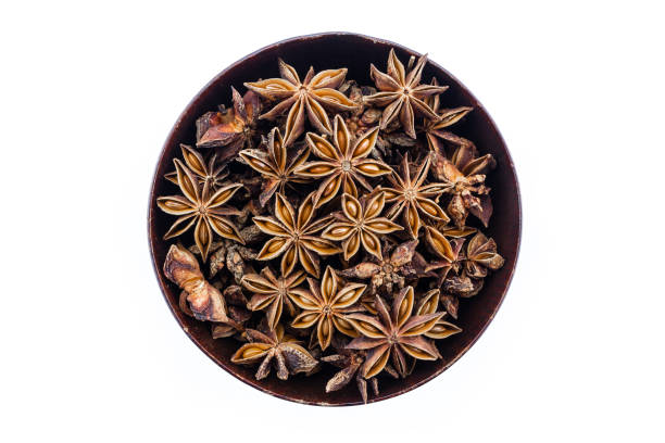 istock star anise in wooden bowl on white background. 1227189681