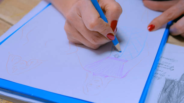 istock Fashion designer drawing design sketch 1227191214