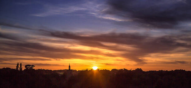 istock Dramatic sunset sky over Boxford Village, Suffolk, England, Europe 1227191876