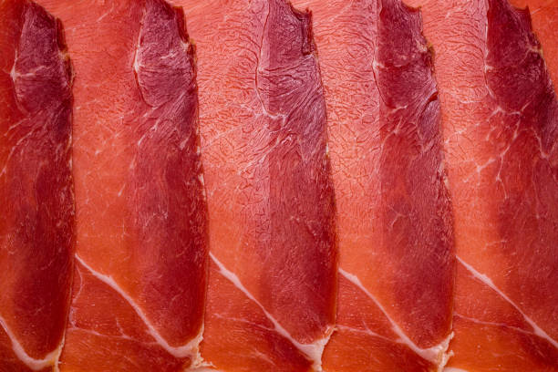 istock Tasty meat background, thinly sliced jamon. 1227195348