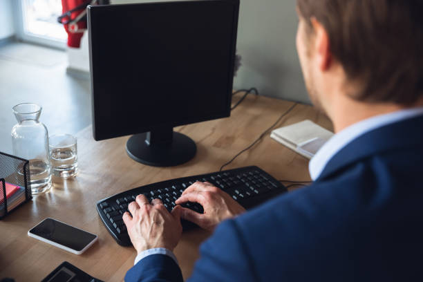 istock Young man, manager, team led return to work in his office after quarantine, feels happy and inspired 1227195464