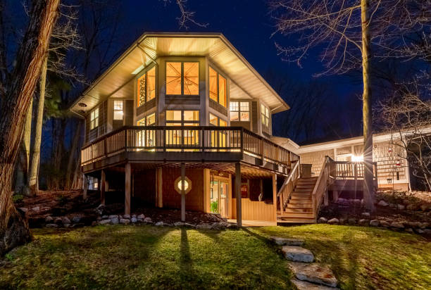 istock Luxury Home in the Woods at Night 1227197165