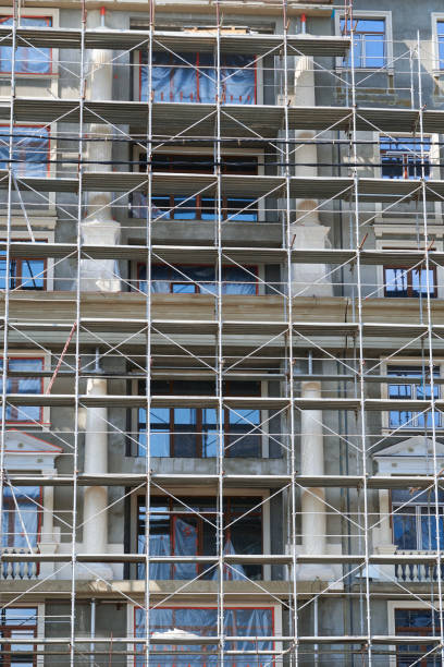istock scaffolding at the facade of a building under construction, multi-storey building, without people 1227197511