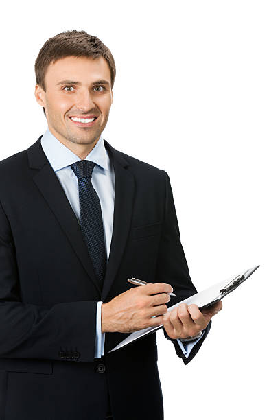 istock Smiling young businessman with clipboard writing, isolated 122719819