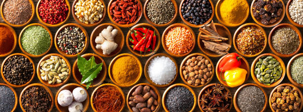 istock Colourful background from various herbs and spices for cooking in bowls 1227198284