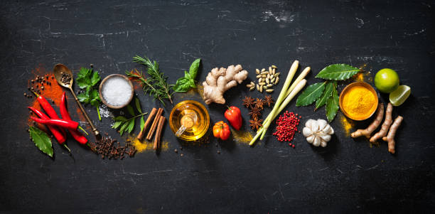 istock Herbs and spices for cooking on dark background 1227198298