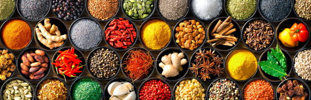 istock Colourful background from various herbs and spices for cooking in bowls 1227198299