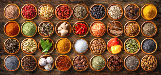 istock Colourful background from various herbs and spices for cooking in bowls 1227198305