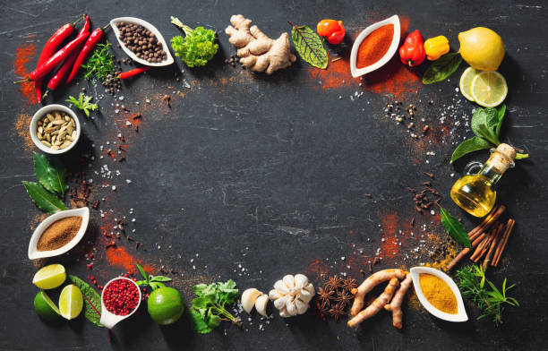 istock Colourful various herbs and spices for cooking on dark background 1227198314