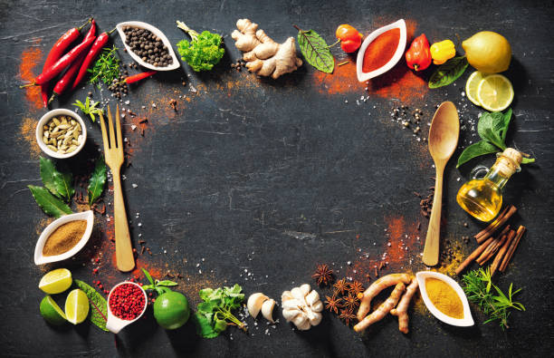 istock Colourful various herbs and spices for cooking on dark background 1227198317