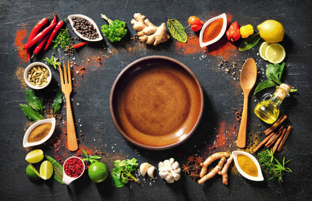 istock Colourful various herbs and spices for cooking on dark background 1227198320