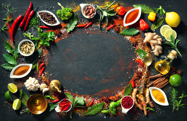 istock Colourful various herbs and spices for cooking on dark background 1227198336
