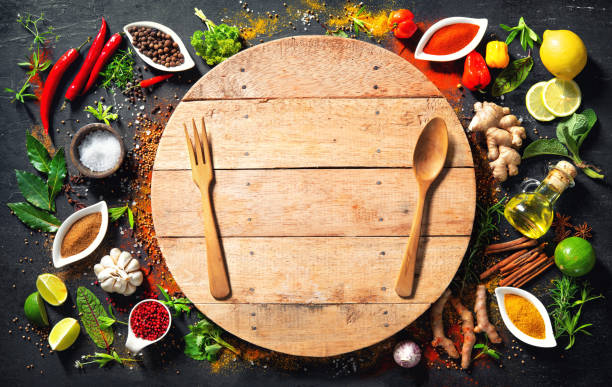 istock Colourful various herbs and spices for cooking on dark background 1227198337