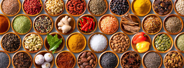istock Colourful background from various herbs and spices for cooking in bowls 1227198341