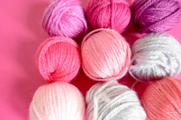 istock Balls of wool pink background 1227200308