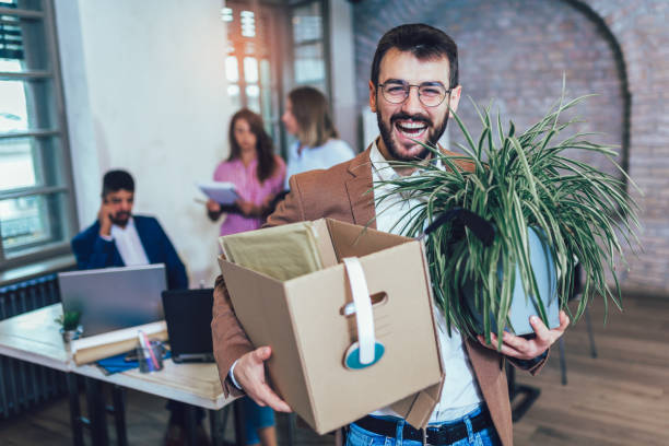 istock Male employee leaving the office with his personal stuff. 1227201900