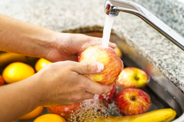 istock Cleaning fruits and vegetables. Covid-19 1227202880