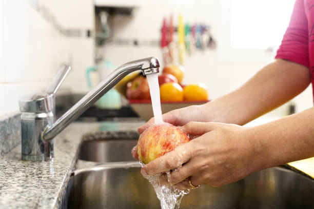 istock Cleaning fruits and vegetables. Covid-19 1227202884