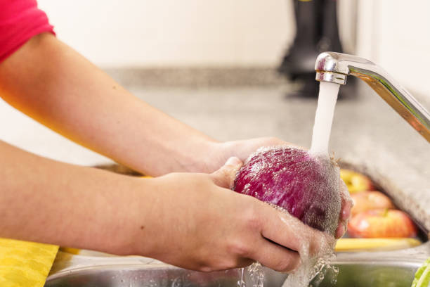 istock Cleaning fruits and vegetables. Covid-19 1227203011