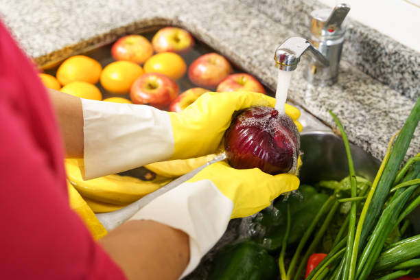 Cleaning fruits and vegetables with latex gloves for coronavirus