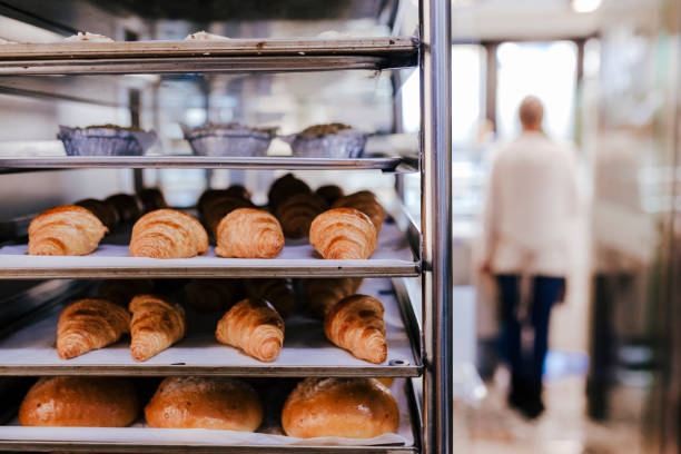 istock unrecognizable woman on bakery. selective focus with croissants and bread 1227204126