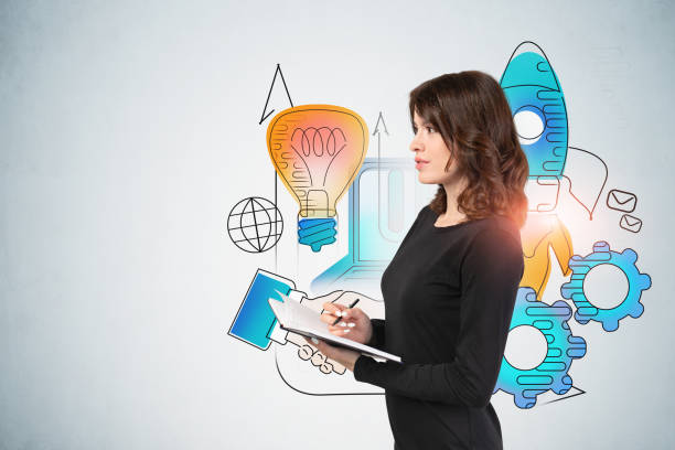 istock Woman with notebook and her startup project 1227204650
