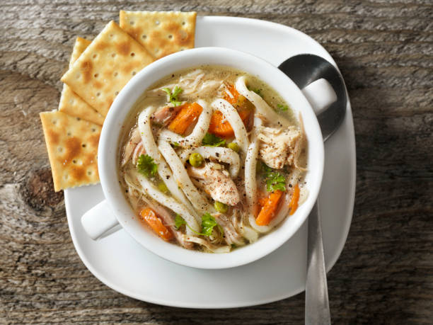 Home Made Chicken Soup with Thick Noodles and Crackers