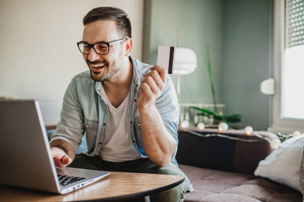 istock Young man shopping from home 1227205770