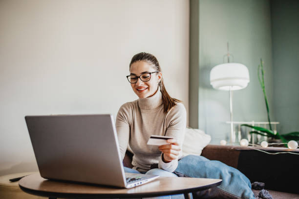 istock Young woman shopping from home 1227205909