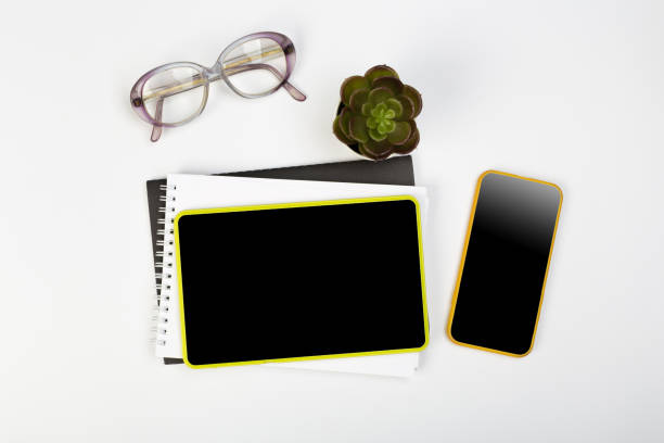istock Tablet mockup and stationery on a white table with open space for text. Flat lay. 1227207047