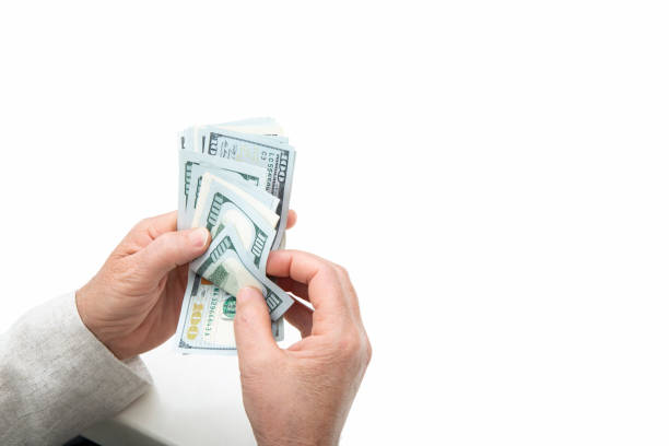 istock Unrecognizable mature woman holding US Dollar bills 1227207048