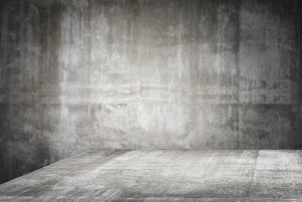 istock empty table top Ready for product display montage; cement table and gray cement background. 1227209959