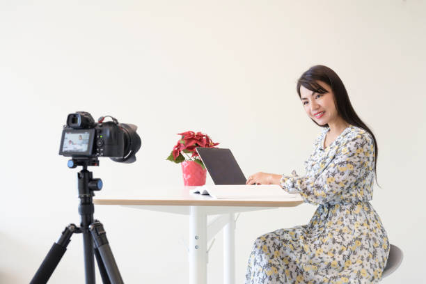 istock Woman record online video on camera 1227210149