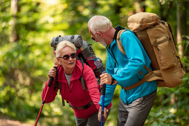 istock Senior couple walking in the forest. 1227211360