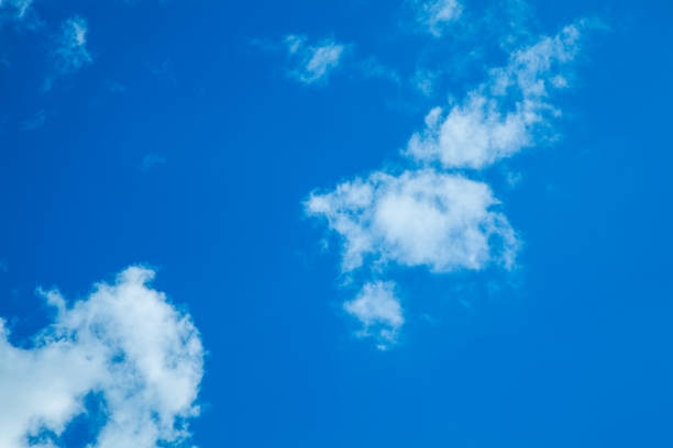 istock White clouds on a background of blue sky. Clear sky with fluffy light clouds. 1227212784