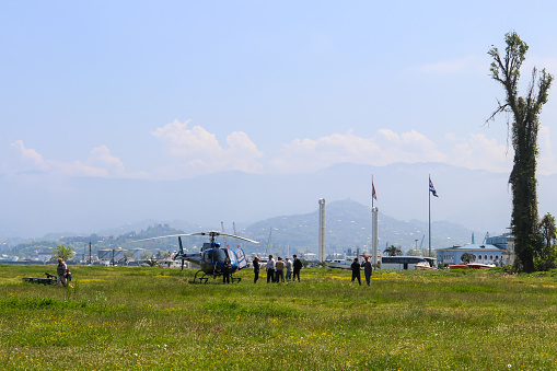 Batumi, Adjara,Georgia - May 3, 2018: Blue helicopter on a lawn in Batumi, Georgia