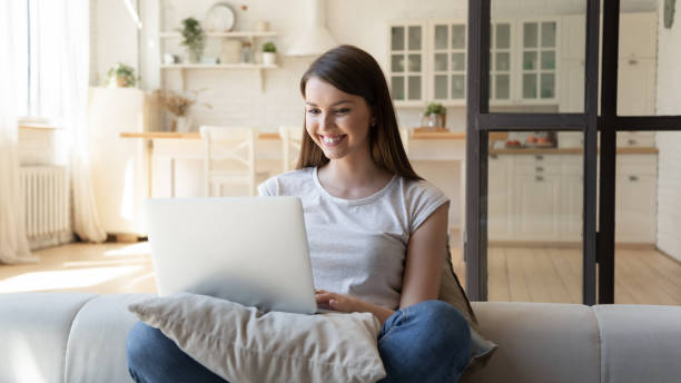 istock Happy woman using laptop checking email good news online. 1227218621
