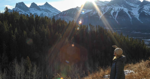 istock Woman walks along mountain pathway in winter 1227220998