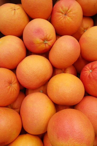 a bunch of ripe grapefruit stock photo