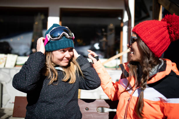 istock Friends enjoying a sunny day at a ski lounge 1227224605