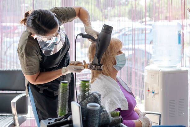 Senior woman  in the hair salon stock photo