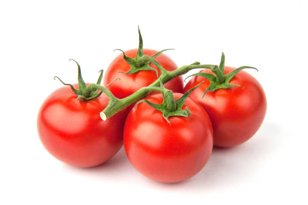 istock Branch of ripe cherry tomatoes isolated on white background 1227224755