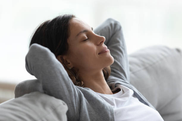 istock Close up serene beautiful woman relaxing with hands behind head 1227225949